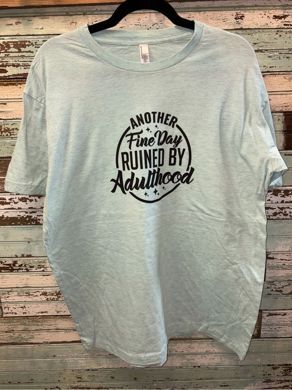 American Apparel Light Blue Graphic Tee with Black Text